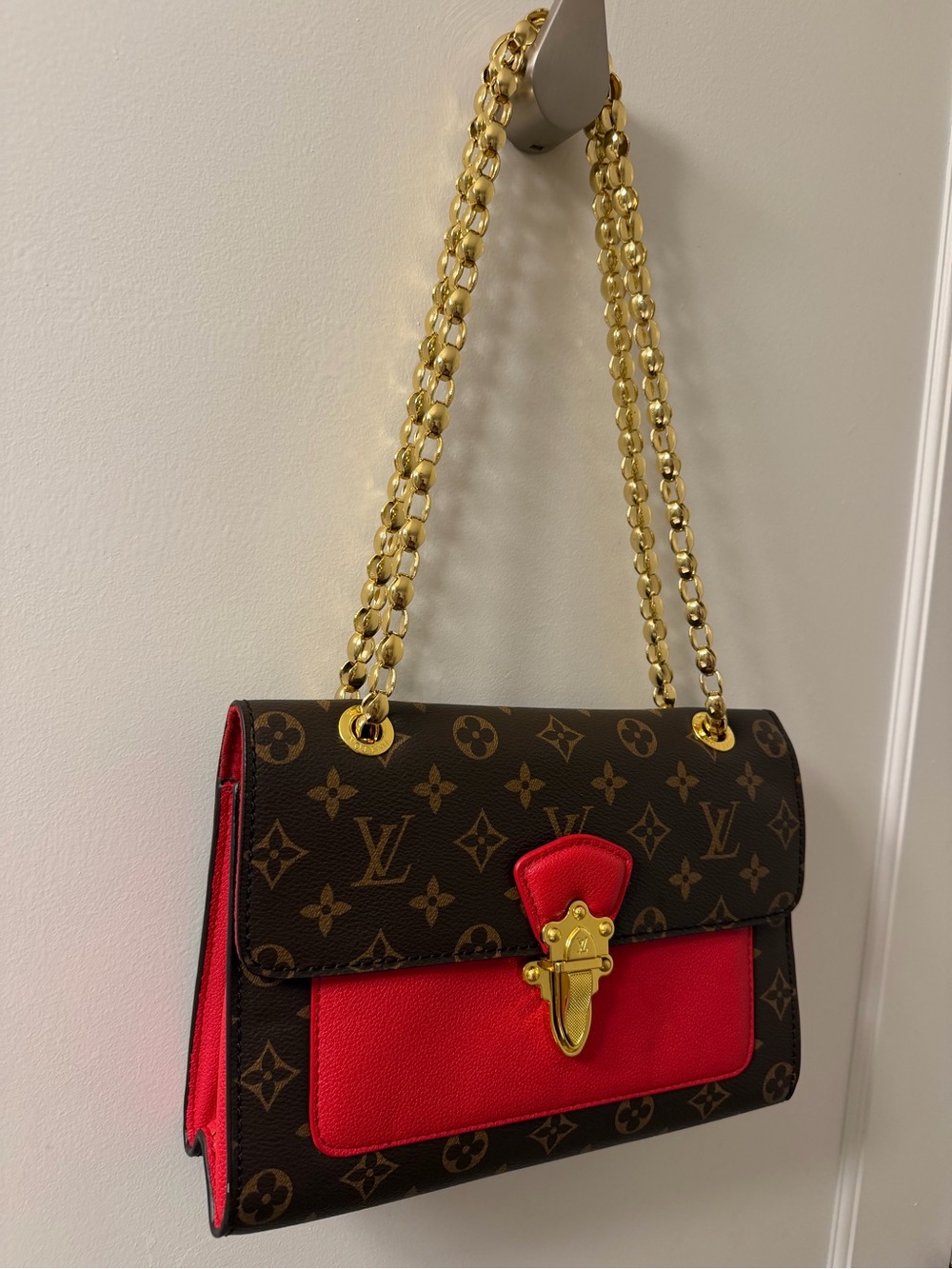 Louis Vuitton Brown Monogram Shoulder Bag with Red Accents and Gold Chain